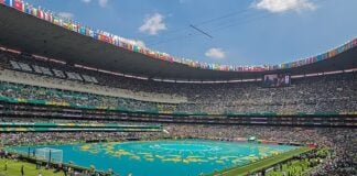 Mexico City’s main stadium, full of green, ahead of World Cup opening ceremony.