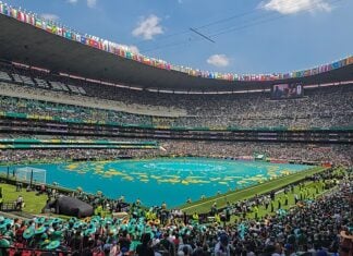 Mexico City’s main stadium, full of green, ahead of World Cup opening ceremony.