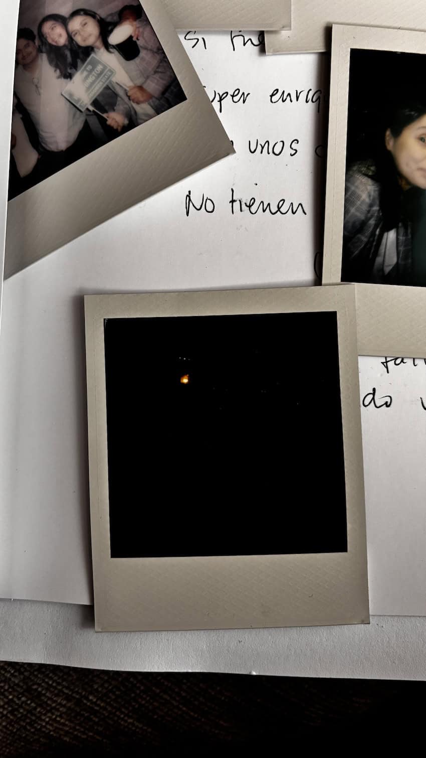 Polaroids from María's despedida — the accumulated affection of a lot of people. The most moving one, without question, is the one that came out entirely black.