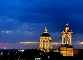 Summer evenings in San Miguel highlight church towers and other historic buildings backed by lingering sunsets.
