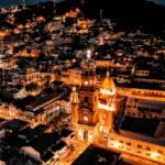Aerial view of Parroquia Nuestra Señora de Guadalupe in Puerto Vallarta at night.
