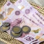 Pesos in a basket left as a tip