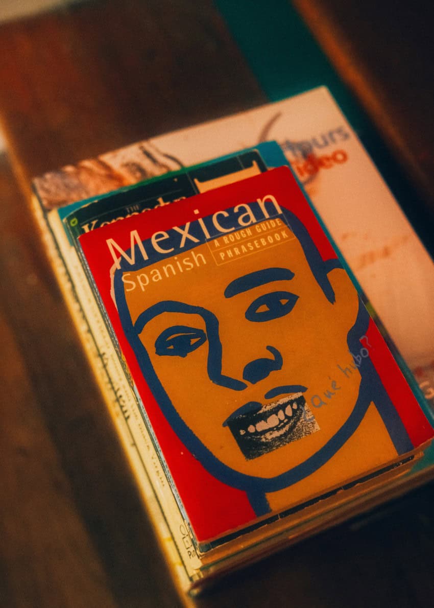 Small phrase book for learning Mexican Spanish sits on a table