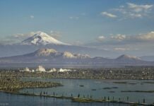 A visual reimagining of the ancient city with mountains in the background