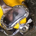 A diver in a yellow mask