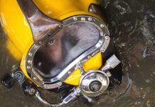 A diver in a yellow mask