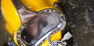 A diver in a yellow mask