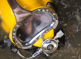 A diver in a yellow mask