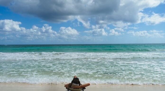 person lying looking at a Tulum beach