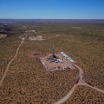 image of hydraulic fracturing unit with blue sky