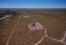 image of hydraulic fracturing unit with blue sky