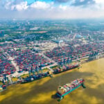 Aerial view of cargo ships docked at Cat Lai terminal in Ho Chi Minh City, Vietnam's busiest port.