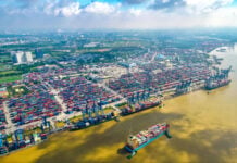 Aerial view of cargo ships docked at Cat Lai terminal in Ho Chi Minh City, Vietnam's busiest port.