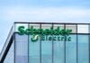 Rueil-Malmaison, France - August 13, 2023: Sign and logo on the headquarters building of Schneider Electric, a French multinational company specializing in digital automation and energy management