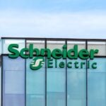 Rueil-Malmaison, France - August 13, 2023: Sign and logo on the headquarters building of Schneider Electric, a French multinational company specializing in digital automation and energy management
