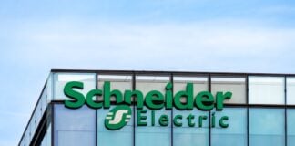 Rueil-Malmaison, France - August 13, 2023: Sign and logo on the headquarters building of Schneider Electric, a French multinational company specializing in digital automation and energy management