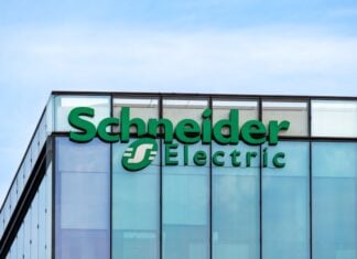 Rueil-Malmaison, France - August 13, 2023: Sign and logo on the headquarters building of Schneider Electric, a French multinational company specializing in digital automation and energy management