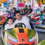 A father and son ride bumper cars at the San Pedro Cholula Fair in Puebla.