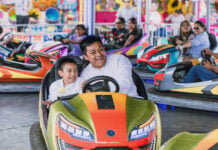 A father and son ride bumper cars at the San Pedro Cholula Fair in Puebla.