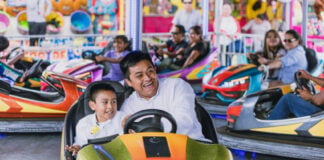 A father and son ride bumper cars at the San Pedro Cholula Fair in Puebla.