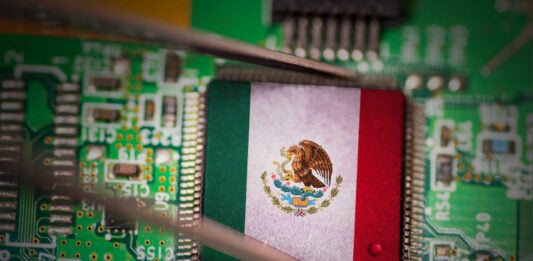 A CPU computer chip with a Mexican flag