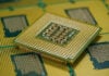 Macro shot of CPU showing grid array of contact pins for motherboard fitting