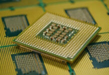 Macro shot of CPU showing grid array of contact pins for motherboard fitting