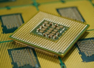 Macro shot of CPU showing grid array of contact pins for motherboard fitting
