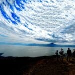 Hikers enjoy the view of Lake Chapala from the glider launch point