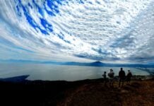 Hikers enjoy the view of Lake Chapala from the glider launch point