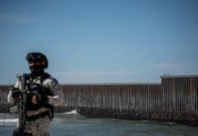 National Guard troops patrol the beach along the U.S. border wall in Tijuana in February.
