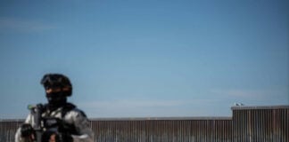 National Guard troops patrol the beach along the U.S. border wall in Tijuana in February.