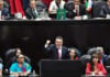 Alejandro Moreno, leader of Mexico's PRI party, speaking at a podium during a congressional session in Mexico City.