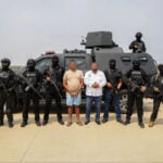 SSPC and Army troops pose with Juchitán Mayor Miguel Sánchez Altamirano and associate Alberto de la Paz López after they were arrested on organized crime-related charges in Oaxaca