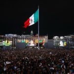 Mexico flag flying high from the Zócalo