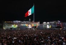 Mexico flag flying high from the Zócalo