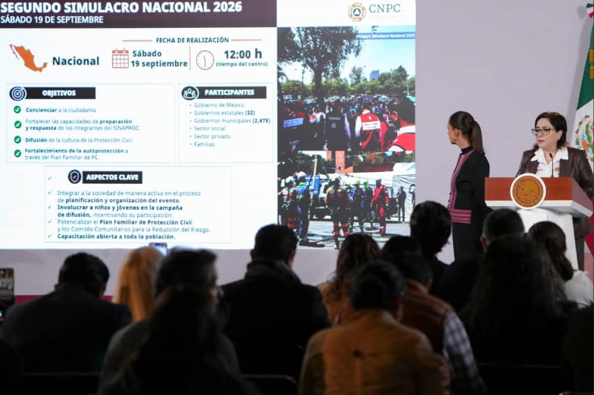 National Civil Protection chief Laura Velázquez shares a slide about the second 2026 national earthquake drill, as President Sheinbaum looks on