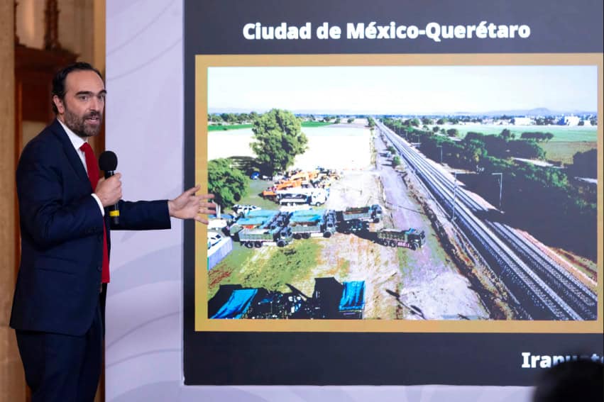 Andres Lajous, director of the Trains and Integrated Public Transport Agency, shares a slide showing an image of the Mexico City-Querétaro railway construction