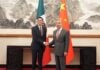 Mexico's Foreign Affairs Minister Roberto Velasco shakes hands with his Chinese counterpart Wang Yi in Beijing