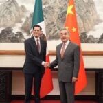 Mexico's Foreign Affairs Minister Roberto Velasco shakes hands with his Chinese counterpart Wang Yi in Beijing