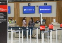Passengers check in for a flight at the Aeroméxico ticket counter at Felipe Ángeles International Airport (AIFA).