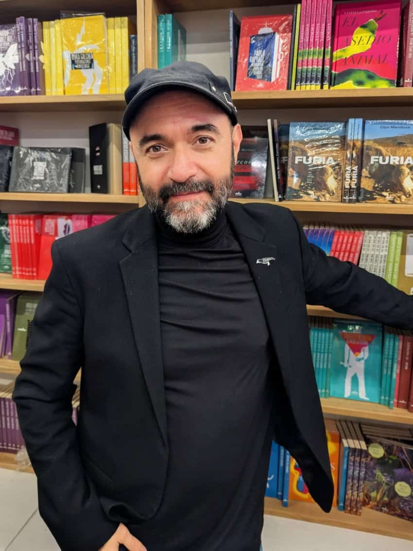 Bernardo Esquinca, noted Mexican writer of "Facing El Chapo," poses in a bookstore