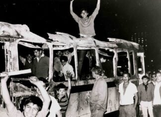 Student protesters on a burned bus in July 1968 in Mexico City