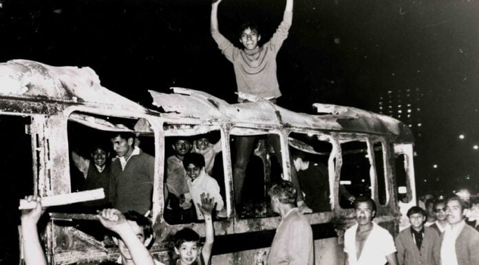 Student protesters on a burned bus in July 1968 in Mexico City