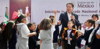 Education Minister Mario Delgado surrounded by school children at the opening of the National Days of Traditional Games in Mexico City on September 9