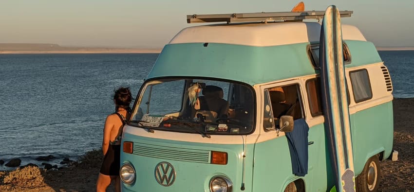 Vintage VW van with surfboards on the coast of Baja California Sur