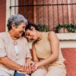 Grandmother and granddaughter together outdoor
