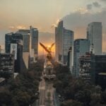 An aerial view of the Angel de la Independencia in Mexico City at sunset.