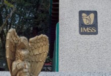 Xalapa, Mexico - February 24, 2026 - Photograph of the entrance to IMSS Health Clinic No. 10 in the city of Xalapa, featuring a golden angel statue next to the sign.