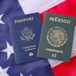 United States and Mexican passports on American flag background, dual citizenship and international travel concept